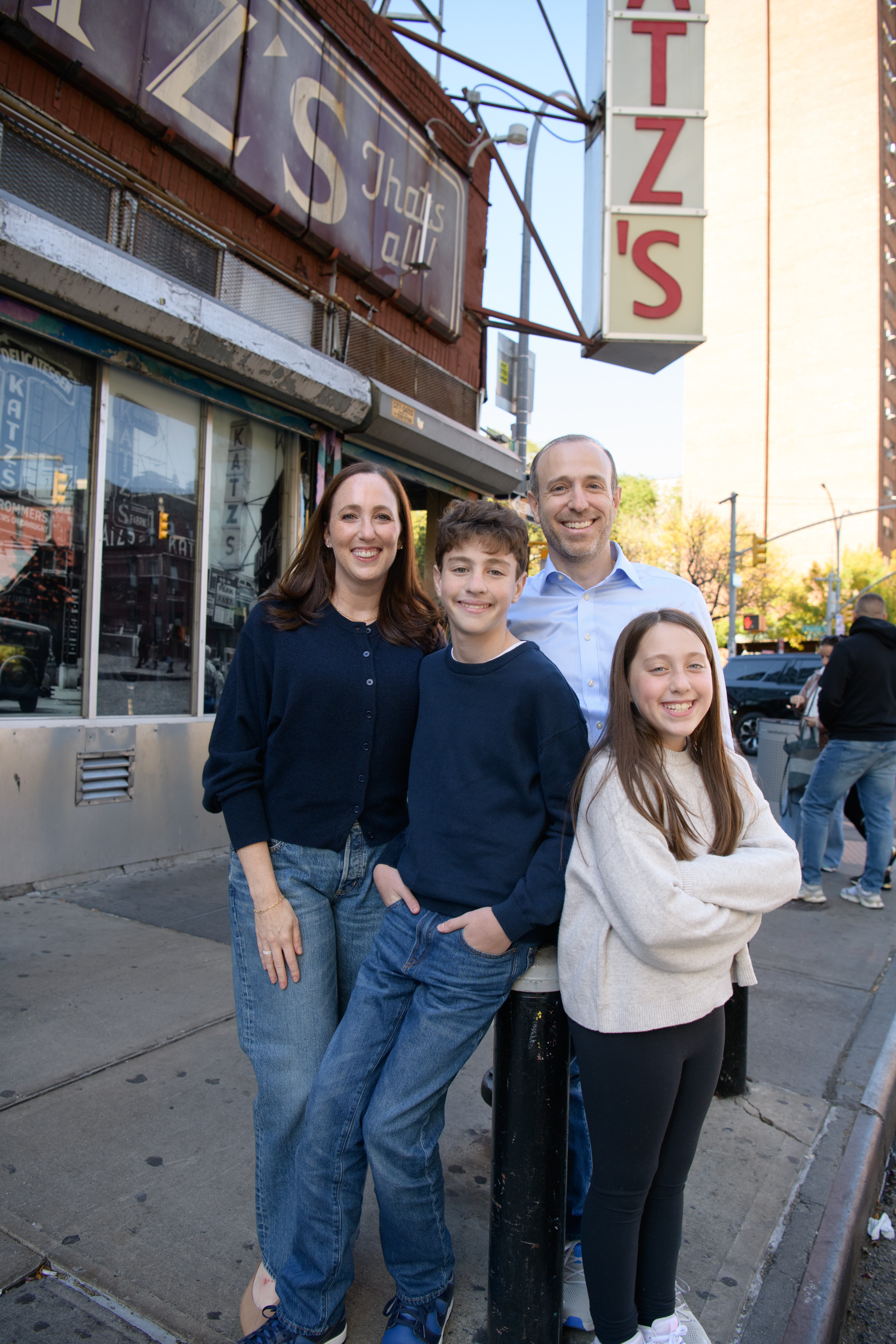 The Weckstein family standing on the sidewalk outside Katz's Delicatessen
